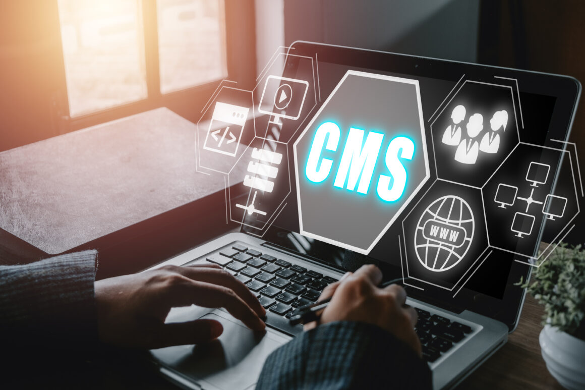 cms-content-management-system-concept-person-hand-using-laptop-computer-with-content-management-system-icon-virtual-screen-background-business-web-computer-website-administration-1160x773 Best CMS for Startups in 2026 (Scalable and SEO-Friendly)